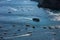 Ferry boat passes fishing boats moored in Tyrrhenian Sea near Positano Italy