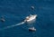 Ferry boat passes fishing boats moored in Tyrrhenian Sea near Positano Italy