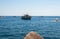 Ferry boat passes fishing boats moored in Tyrrhenian Sea near Positano Italy