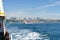 Ferry boat passing Bosphorus. panorama of european part of Istanbul city at background, Besiktas area