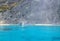 Ferry boat with tourists on Egremnoi beach, Lefkada island, Greece. Beautiful blue water.