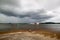 Ferry boat under rainstrom cloud