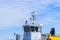 Ferry boat white cabin with big windows. Wing of running bridge of cruise liner. white cruise ship on a blue sky with navigation