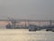 A ferry and a cargo ship moored on the banks of the Tagus River, in the evening light, Lisbon, Portugal, Europe