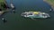 Ferry crosses a river in The Netherlands seen from above