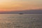 A ferry crosses the Solent at sunset bound for the Isle of Wight