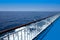 Ferry cruise railing in a blue sea ocean