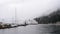 Ferry departing harbour on rainy day in West Vancouver, Canada.