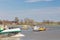 Ferry on the Dutch flooded river IJssel in the province of Gelderland with ship passing by