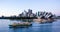 Ferry passes in front of Sydney Opera House with the city in the background