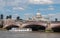 Ferry passes under Blackfriars Bridge on Thames with St. Paul\'s