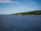 Ferry passing close to Sucuraj lighthouse on Hvar island, Croatia