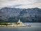 Ferry passing close to Sucuraj lighthouse on Hvar island, Croatia