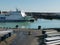 Ferry quay in Sweden with ships and waiting cars