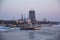 Ferry Road Way From the Waves and Ice on the Sea Surface After the Ship. Riga Panorama in the Background