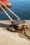 Ferry rope tied to metal boat slip at dock