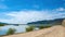 A ferry on the Selenga River - the largest inflow of Lake Baikal in the vicinity of the village of Tataurovo. A bypass road along