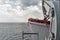 Ferry ship lifeboat under heavy rain