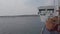 The ferry slips on the calm sea towards the island of San Pietro, Sardinia Italy