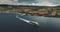 Ferry terminal, Brodick Gulf aerial view. Ship near shore with greenery lands and mountains