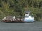 Ferryboat makes the crossing of cars through the Bertioga channel