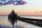 Ferryboat near the pier at sunset