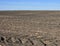 Fertile, plowed soil of an agricultural field