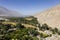 Fertile Wakhan Valley near Vrang in Tajikistan. The mountains in the background are the Hindu Kush in Afghanistan