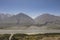 Fertile Wakhan Valley with Panj river near Vrang in Tajikistan. The mountains in the background are the Hindu Kush in Afghanistan