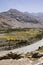 Fertile Wakhan Valley with Panj river near Vrang in Tajikistan. The mountains in the background are the Hindu Kush in Afghanistan