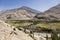 Fertile Wakhan Valley with Panj river near Vrang in Tajikistan. The mountains in the background are the Hindu Kush in Afghanistan