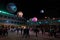 Festival, inflatable balloons in the shape of planets, people at night