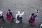 festival of the sun inti raymi with typical clothes dancing and typical hat top view with cobblestone street background -