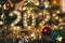 Festive 2025 numerals amidst Christmas decorations with warm golden tones