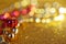 Festive abstract background of golden and red Christmas tinsel and many yellow lights. Defocus show. Blank for greeting card. Free