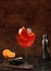 Festive alcoholic cocktail Aperol spritz in glasses on a dark background, concept for bar and New Year\\\'s Eve,