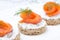 Festive appetizer - canape with rye bread, cream cheese, salmon