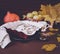 Festive apple pie with powdered sugar close-up with autumn leaves and pumpkin on the table