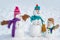 Festive Art Greeting Card. Design Gift Handmade. Funny group of snowmen family hold Christmas gift. New Year greeting