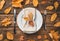 Festive, autumn, culinary background with a plate, serving napkin and cutlery.