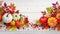 Festive autumn decor from pumpkins, berries and leaves on a white wooden background. Concept of Thanksgiving day or Halloween.