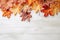 Festive autumn leaves decor on white wooden table with copy space , Textured vintage background. Generative AI