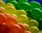 Festive background of blue green yellow organge and red baloons