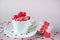Festive background. Coffee cup, full of multicolor sweet sprinkles sugar candy hearts and packing Valentine`s Day gift