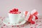 Festive background. Coffee cup, full of multicolor sweet sprinkles sugar candy hearts and packing Valentine`s Day gift