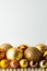 Festive background of golden textured Christmas balls