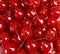 Festive background of red cocktail maraschino cherries
