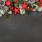 Festive Background with Red Star Baubles and Winter Flora