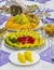 Festive banquet table decorated with plates with vegetable and fruit cuts. Delicious snack.