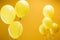 Festive bright minimalistic balloons on yellow background.